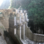 The 30-meter-high concrete gravity dam.