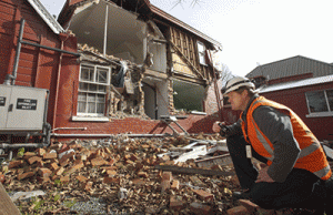 MWH Surveying-the-damage-to-a-Christchurch-home