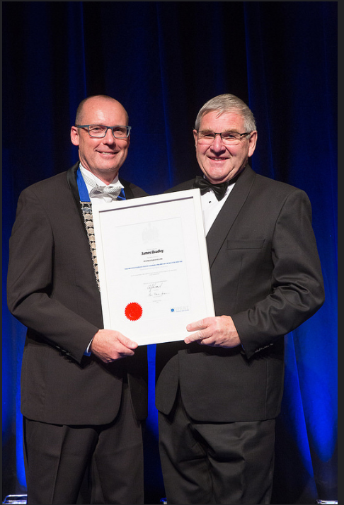 Jim accepting his Distinguished Fellow certificate